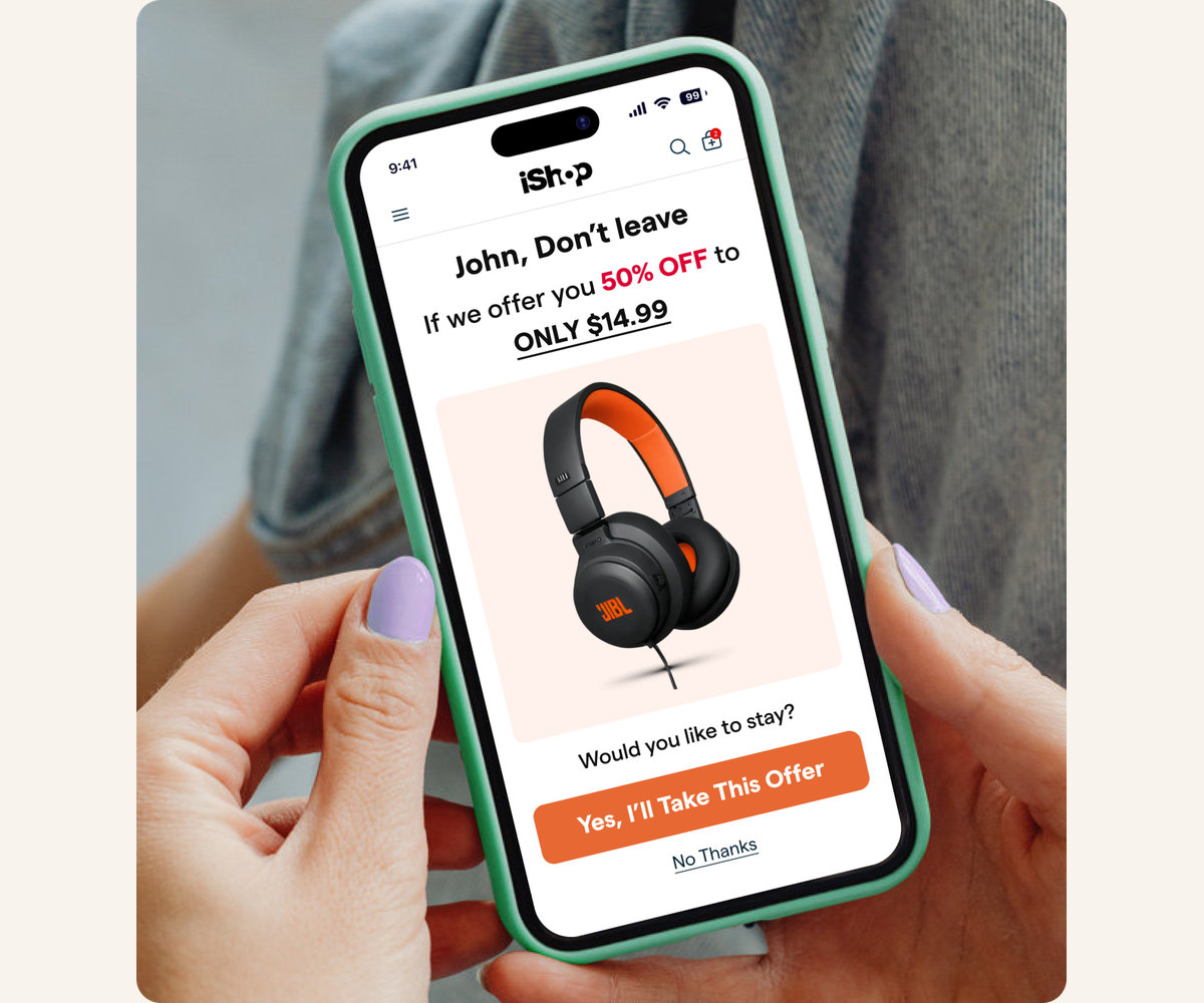 A customer holding a phone with a branded "John, don't leave yet" order-cancel offer for 50% off headphones and a "Yes, I'll take this offer" button